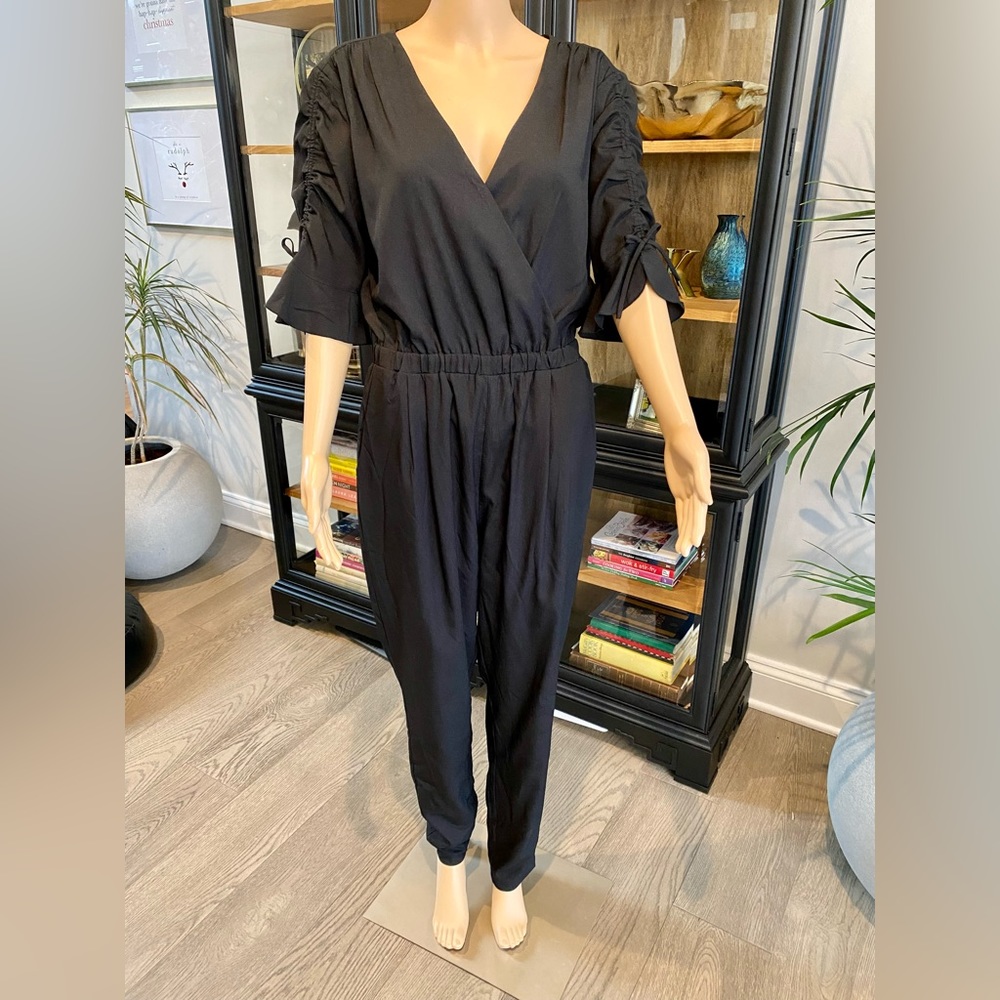 Bebe black v neck women’s jumpsuit M